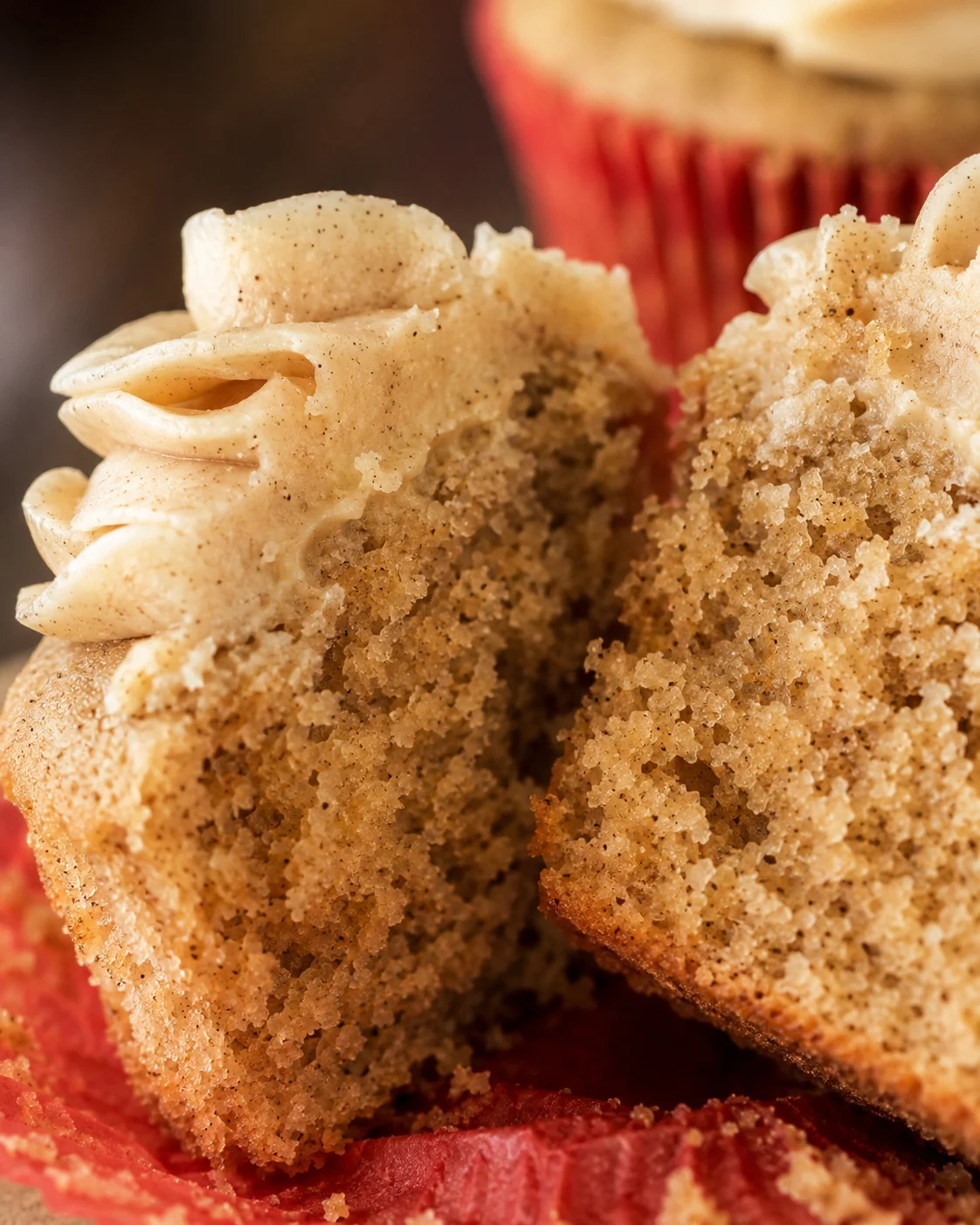 Close-up of moist apple cider cupcakes with spiced frosting, perfect for fall.